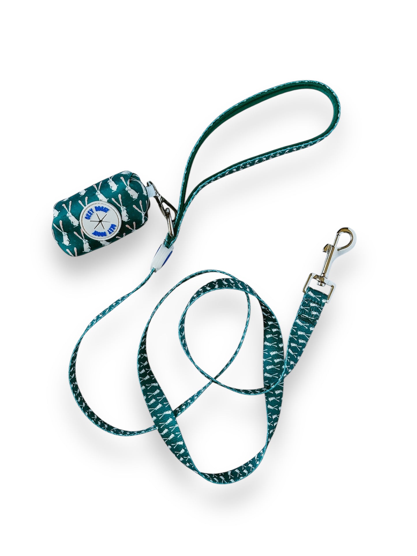 Green rabbit print waste bag holder clipped to matching dog leash – coordinated and stylish dog walking accessories