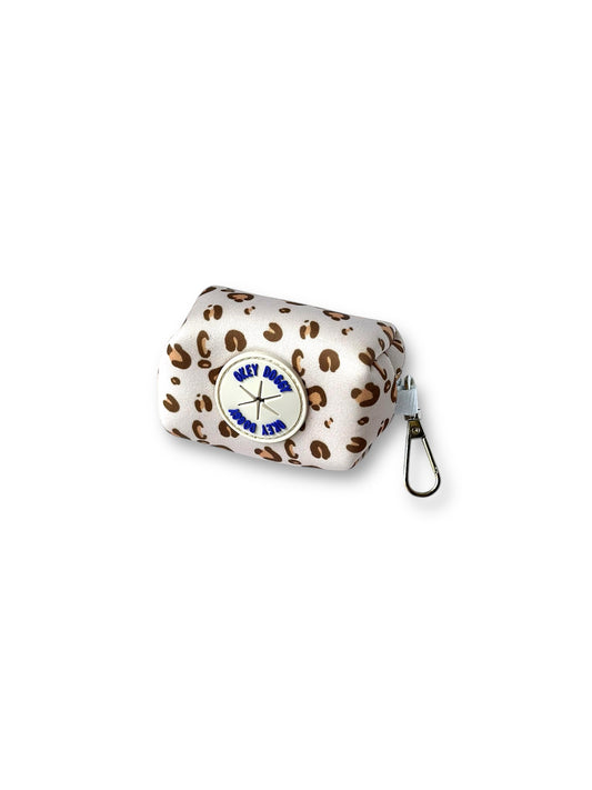 Leopard print waste bag holder attached to matching dog leash – stylish and practical dog walking accessory